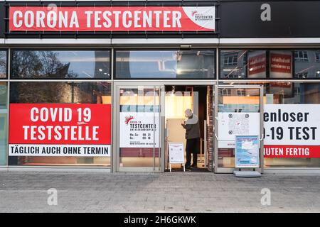 Berlin, Germany. 15th Nov, 2021. A man enters a COVID-19 test center in Berlin, Germany, on Nov. 15, 2021. Due to rapid increase of new COVID-19 cases, Berlin on Monday started to tighten COVID-19 measures. Germany's seven-day incidence rate hit a new all-time high and reached 303.0 per 100,000 inhabitants, the Robert Koch Institute (RKI) for infectious diseases announced on Monday. Credit: Shan Yuqi/Xinhua/Alamy Live News Stock Photo