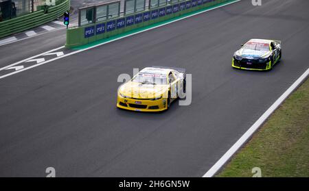Vallelunga, Italy, october 29 2021. American festival of Rome. High angle view of racing Nascar cars Ford Mustang and Chevrolet Camaro challenging on Stock Photo