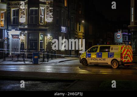 Morecambe Lancashire, United Kingdom. 15th Nov, 2021. Lancashire Police have cordened off an area of Marine Road Central out side the Crown Hotel which was closed at the time of the incident, following a multiple Police Vehicle and Ambulance response after a reports of a fire arm being discharged at 5.56 pm in the alleway at the rear of Skipton Street behind the Crown Hotel. A Man in his twentys has been taken to hospital in a serious but stable condition. Credit: PN News/Alamy Live News Stock Photo