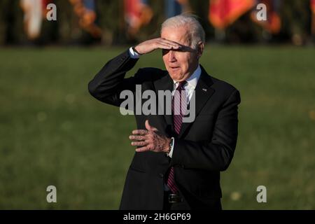 Washington, USA. 15th Nov, 2021. President Joe Biden, listens during the signing ceremony for the Infrastructure Investment and Jobs Act on the South Lawn at the White House on November 15, 2021 in Washington, DC. (Photo by Oliver Contreras/SIPA USA) Credit: Sipa USA/Alamy Live News Stock Photo