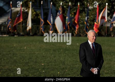 Washington, USA. 15th Nov, 2021. President Joe Biden, listens during the signing ceremony for the Infrastructure Investment and Jobs Act on the South Lawn at the White House on November 15, 2021 in Washington, DC. (Photo by Oliver Contreras/SIPA USA) Credit: Sipa USA/Alamy Live News Stock Photo