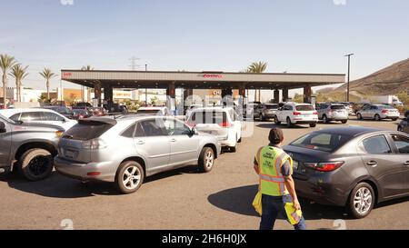 (211115) -- LOS ANGELES, Nov. 15, 2021 (Xinhua) -- Vehicles queue to refuel at a gas station in Los Angeles, California, the United States, on Nov. 15, 2021. The average price of gas in California reached 4.682 U.S. dollars per gallon on Monday, setting a new record for the most populous U.S. state for a second consecutive day. According to the American Automobile Association (AAA), the average price for regular gasoline was 4.676 U.S. dollars per gallon on Sunday, which already beat the state's previous record of 4.671 dollars for regular gasoline set in October 2012. (Photo by Zeng Hui/Xinhu Stock Photo