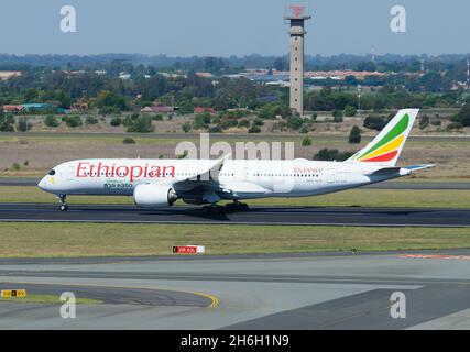 Ethiopian Airlines Airbus A350-900 airplane with special decal celebrating the 10th A350 aircraft of the airline departing Johannesburg, South Africa.