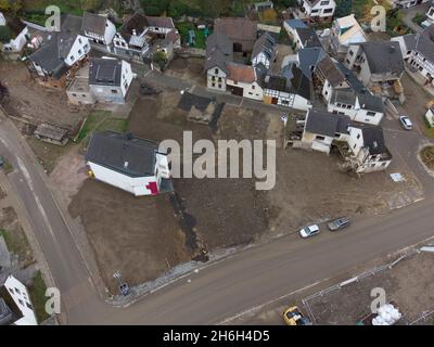 Altenahr Altenstadt, Germany. 05th Nov, 2021. After the demolition of numerous houses destroyed by the flood, the townscape of Altenahr-Altenstadt has changed considerably (aerial photograph taken with a drone). Even months after the flood disaster, everyday life is only very hesitantly returning to the destroyed villages in the Ahr valley. (To dpa report 'Anxiety in the Ahr valley before Christmas' from 16.11.2021) Credit: Boris Roessler/dpa/Alamy Live News Stock Photo