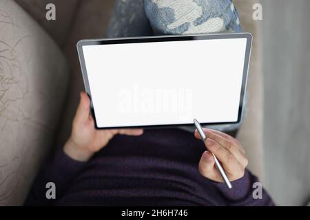 Man surfing internet on modern tablet with stylus Stock Photo