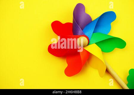 colorful pinwheel with space copy isolated on yellow background Stock Photo