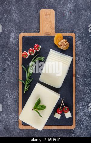 Kashar cheese or kashkaval cheese. Sliced Cheddar Cheese. gourmet cheese. local name taze kasar peyniri Stock Photo