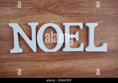 Noel Word alphabet letters with space copy on wooden background Stock Photo