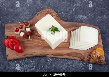 Kashar cheese or kashkaval cheese. Sliced Cheddar Cheese. gourmet cheese. local name taze kasar peyniri Stock Photo