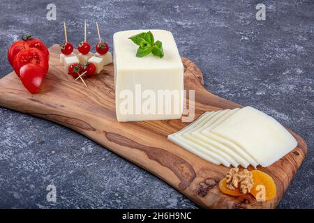 Kashar cheese or kashkaval cheese. Sliced Cheddar Cheese. gourmet cheese. local name taze kasar peyniri Stock Photo