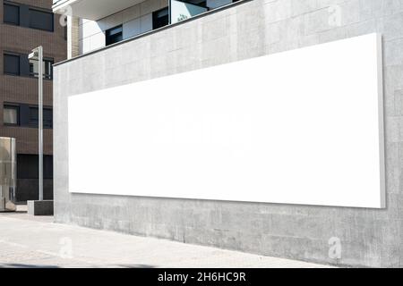 Blank advertising billboard on building wall useful for products advertisement Stock Photo