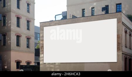 Blank advertising billboard on building wall useful for products advertisement Stock Photo
