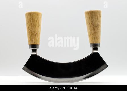 Mincing knife with double wooden handle isolated on white background. Stock Photo