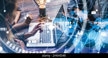 Close-up photo of female hands with laptop. Young woman working remotely at home. Concept of networking or remote work. Global business network. Onlin Stock Photo
