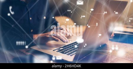 Close-up photo of male hands with laptop. Man working remotely at home. Concept of networking or remote work. Global business network. Online courses. Stock Photo