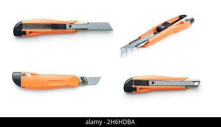 Plastic orange utility knife isolated on white background. Stock Photo
