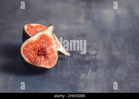 Fresh ripe figs on kitchen table. Stock Photo