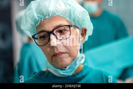 Health, medicine and pandemic concept. Doctors, medical workers working in a hospital. Stock Photo
