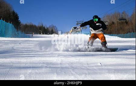 (211116) -- FUSONG, Nov. 16, 2021 (Xinhua) -- A skier enjoys the sport at Changbaishan Ski Resort in northeast China's Jilin Province, Nov. 15, 2021. Following the recent snowfall and drop in temperature, a new ski season has kicked off in northeast China's Jilin Province. Jilin, with rich ice and snow resources, has long been one of the most popular skiing destinations in the country. Due to the rising skiing boom around the country in recent years, the ski resorts in Jilin have seized the opportunity to improve the infrastructures and services. As the 2022 Beijing Winter Olympics approaches, Stock Photo