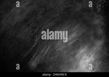 Black scratched metal texture in low light background Stock Photo