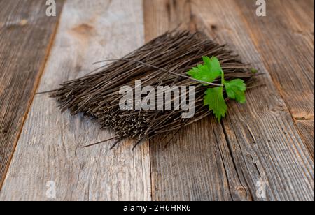 Plant based high protein pasta with dried lentl spaghettis on wooden background Stock Photo