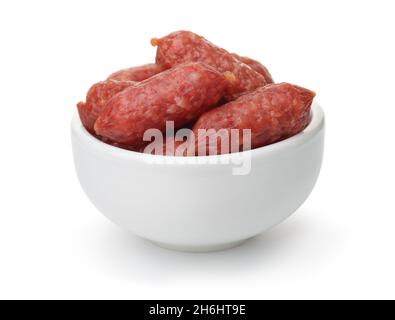 White ceramic bowl of mini smoked sausages isolated on white Stock Photo