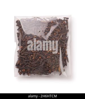 Top view of dried cloves in plastic bag isolated on white Stock Photo
