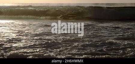 Fuerteventura, west coast, powerful ocean waves at sunset time, partially translucent Stock Photo