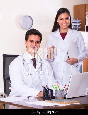Two doctors in private clinic . Stock Photo