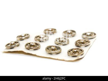 Steel buttons on white background with selective focus Stock Photo