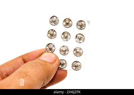 Steel buttons on white background with selective focus Stock Photo