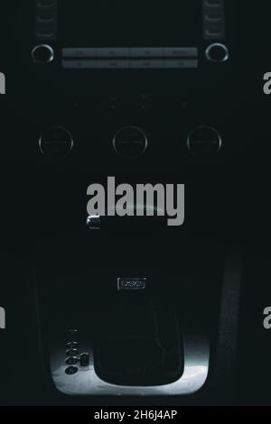 Vertical shot of the dashboard of a car with the automatic transmission in moody style Stock Photo