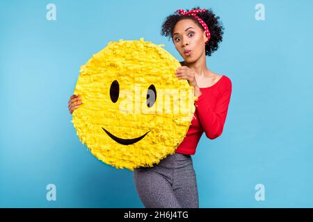 Photo of shocked lady hold yellow smiling face website chatting concept isolated over blue color background Stock Photo