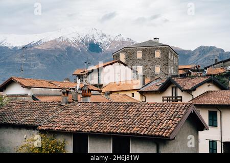 Small town against the backdrop of mountains. Lake Como, Italy Stock Photo