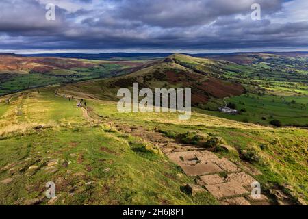 The stone path leading from Mam Tor, with a view along the pathway Great Ridge to Back Tor and Lose Hill, in the Peak District National Park. Stock Photo