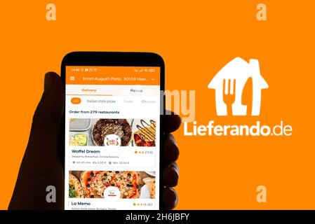 Spain. 16th Nov, 2021. The food delivery app Lieferando logo is seen on the screen of a mobile phone and the display of a laptop in Barcelona, Spain on November 16, 2021 (Photo by Davide Bonaldo/Sipa USA) Credit: Sipa USA/Alamy Live News Stock Photo