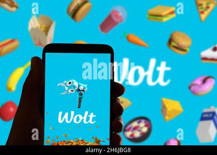 Spain. 16th Nov, 2021. The food delivery app Wolt logo is seen on the screen of a mobile phone and the display of a laptop in Barcelona, Spain on November 16, 2021 (Photo by Davide Bonaldo/Sipa USA) Credit: Sipa USA/Alamy Live News Stock Photo