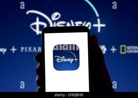 Spain. 16th Nov, 2021. The Disney streaming app Disney  logo is seen on the screen of a mobile phone and the display of a laptop in Barcelona, Spain on November 16, 2021 (Photo by Davide Bonaldo/Sipa USA) Credit: Sipa USA/Alamy Live News Stock Photo