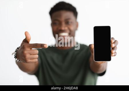 Selective focus on mobile phone with empty screen Stock Photo