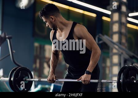 Muscular Middle Eastern Man Making Deadlift Weight Exercise In Gym Stock Photo