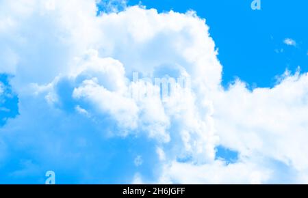 Cotton candy sky, white and blue background, white clouds. Fantasy illustration. Stock Photo