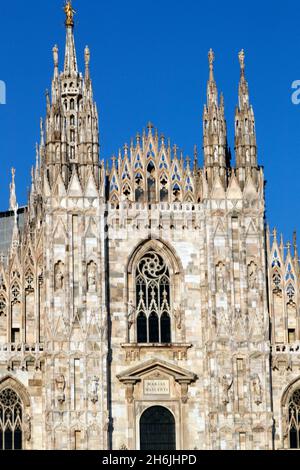 The west facade of the Duomo, the Gothic style cathedral dedicated to St. Mary, Milan, Lombardy, Italy, Europe Stock Photo
