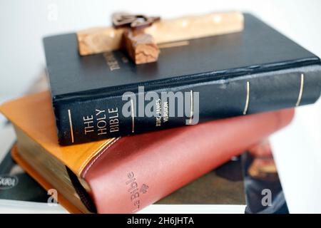 Holy Bibles with wooden cross, Italy, Europe Stock Photo
