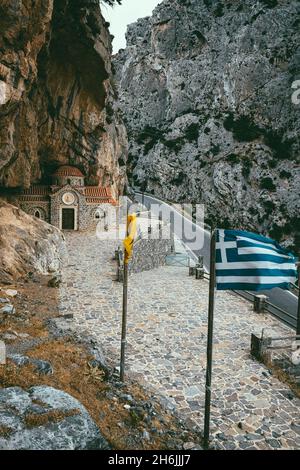 Narrow road crossing Kotsifou gorge nearby the old Agios Nikolaos chapel built in rocks, Crete island, Greek Islands, Greece, Europe Stock Photo