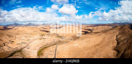 Desert landscape crossed by a road aerial view Stock Photo - Alamy
