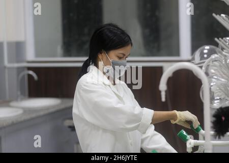Asian woman scientist working in the laboratory Stock Photo