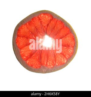 The photo shows a round piece, a pomelo slice. The inside of the exotic  fruit is pink in color, on the outside there is a yellow-green peel. Citrus  si Stock Photo 