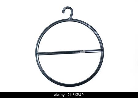 Black Round circular hanger isolated over white background with clipping path included. Plastic hanger for ties, scarves, jewelry Stock Photo