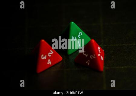 Role Playing Game triangular dices. Selective focus. Stock Photo