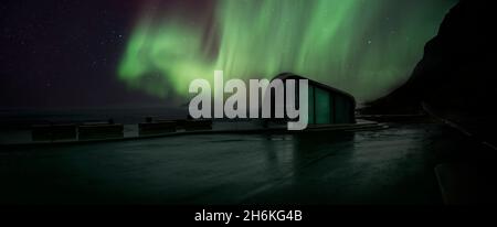 Aurora Borealis over roadside toilets, arctic Norway. Stock Photo